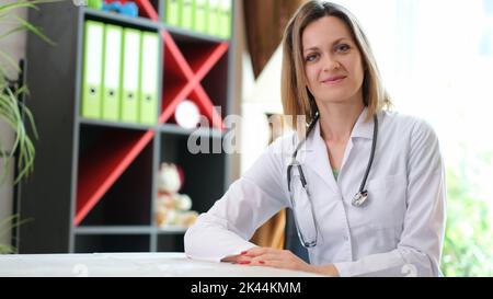 Portrait of smiling female doctor with stethoscope in clinic Stock Photo