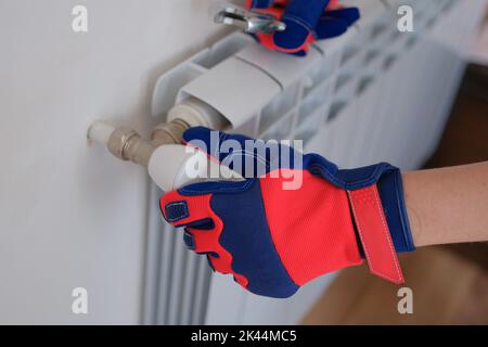 Closeup of heating radiator valve for comfortable temperature control and repair key Stock Photo