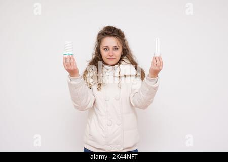 Woman holding an energy saving lightbulb stock photo Stock Photo
