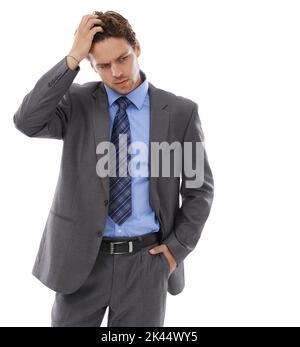 Wondering what the future holds. A worried businessman against a white background. Stock Photo