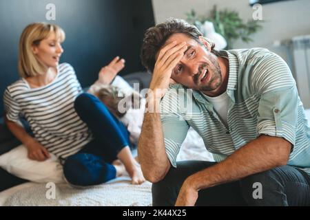 Stressed couple arguing and having marriage problems. People argument, financial problems concept. Stock Photo