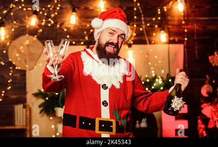 Sparkling wine. Santa claus drinking champagne. Celebrate winter holidays. Indulge yourself in joy. Man bearded santa celebrate christmas with alcohol Stock Photo