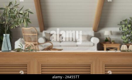 Wooden table top, cabinet, panel or shelf with shutters close up. Olive branch in vase and candles. Blurred background with bohemian wooden living roo Stock Photo