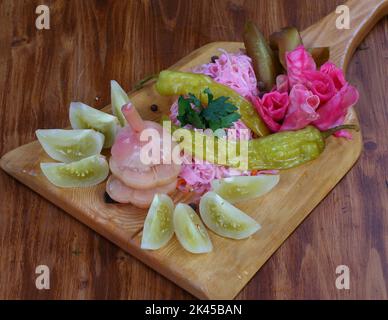 Canned tomatoes and cucumbers Stock Photo