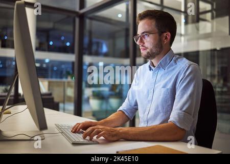 Businessman, computer and night office work for digital programmer, cybersecurity and software design. Thinking web design engineer, developer and Stock Photo