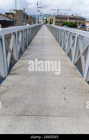 Original footbridge, before it was demolished and replaced by a larger bridge, at the Lagan Weir, Belfast, Northern Ireland, United Kingdom, UK. Stock Photo