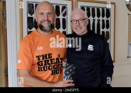 Selkirk, UK. 30th Sep, 2022. Tim Tunnicliff meets Selkirk RFC Membership Secretary, John Rutherford, former Scotland Rugby Internationalist, at Selkirk on Day 24 - Gala RFC to JedForest RFC. The Great Rugger Run 2022 taking place in Scotland between September 7th and October 1st, 2022. The route will take in the West Highlands, Glasgow, Ayrshire, Stirling, Dundee, Edinburgh and finishing in The Borders C Over 500 miles in 25 days! Credit: Rob Gray/Alamy Live News Stock Photo