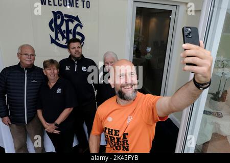Selkirk, UK. 30th Sep, 2022. Tim Tunnicliff takes a selfie with staff and members at rugby clubrooms in Selkirk on Day 24 - Gala RFC to JedForest RFC. The Great Rugger Run 2022 taking place in Scotland between September 7th and October 1st, 2022. The route will take in the West Highlands, Glasgow, Ayrshire, Stirling, Dundee, Edinburgh and finishing in The Borders C Over 500 miles in 25 days! Credit: Rob Gray/Alamy Live News Stock Photo