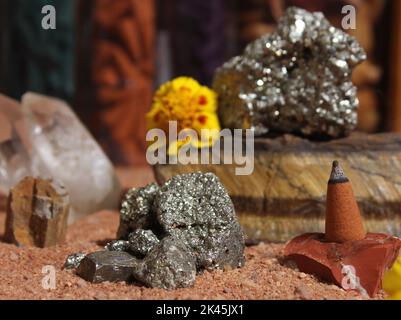 Yellow Flowers With Pyrite Rocks and Crystals on Australian Red Sand Stock Photo