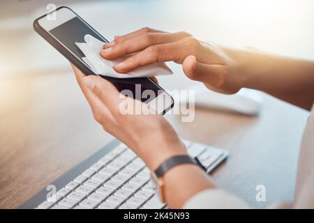 Clean, office and woman hands cleaning phone screen with wet wipes for hygiene, cleaniness and disinfection of bacteria, virus or coronavirus. Closeup Stock Photo
