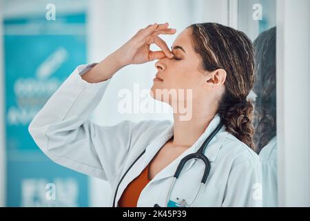 Stress, anxiety and depression doctor in a hospital or clinic suffering from sad, challenge and fail. Woman healthcare or medical worker with mental Stock Photo