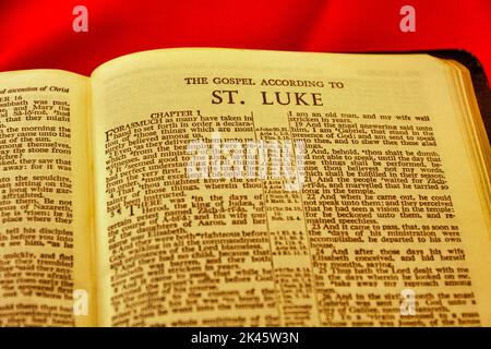 Close up of antique Holy Bible page, shallow depth of field with focus on chapter title heading, St Luke Stock Photo