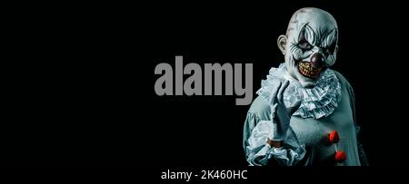 Terrifying clown on black background. Halloween party costume Stock ...