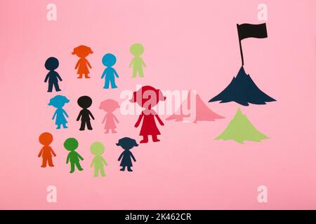 business team, leader leads his team towards the goal, businesswoman creative business concept conquering peaks Stock Photo