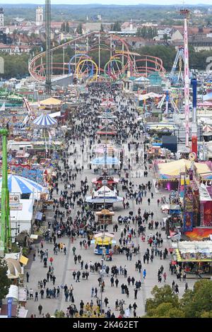Munich, Germany. 30th Sep, 2022. Visitors to the Wiesn and rides are seen at the Oktoberfest from the Paulskirche. The Wiesn will be held from September 17 to October 3, 2022. Credit: Felix Hörhager/dpa/Alamy Live News Stock Photo