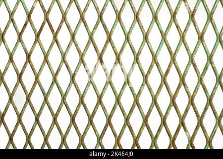 A rhombus shape green metal fence in a close up view Stock Photo