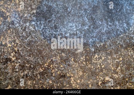 Noble, smoothly ground stone slab with abstract pattern in brown and blue Stock Photo