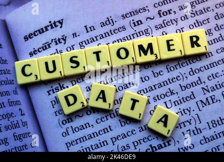 Customer Data,spelled out in Scrabble letters, on the dictionary definition of security Stock Photo