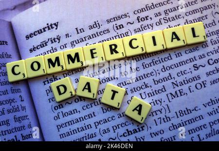 Commercial Data,spelled out in Scrabble letters, on the dictionary definition of security Stock Photo