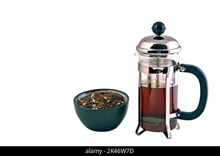 Freshly brewed tea in bulk with a pitcher ready to serve. Stock Photo