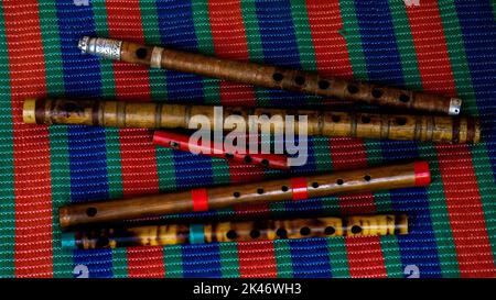 Flute of Bangladesh. Handmade bamboo flute. The flutes are arranged in ...
