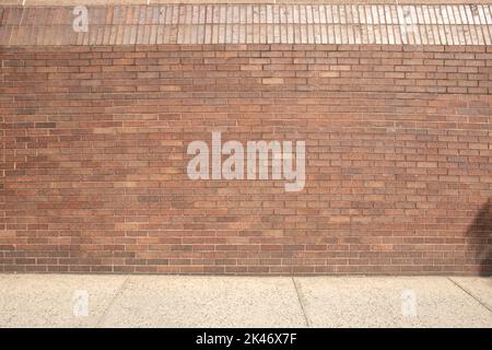 walkway with brick wall side to side parallel abstract Stock Photo