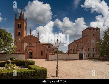 Murello, Cuneo, Piedmont, Italy - September 23, 2022: Templar Castle complex with San Giovanni Battista church in Church Street Stock Photo