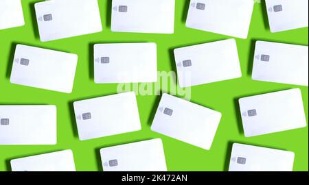 White Credit Cards With EMV Chip on Green. Credit Card Mock up Stock Photo
