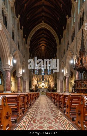 Cobh, Ireland - 15 August, 2022: vertical view of the central nave and altar inside the Cobh Cathedral Stock Photo