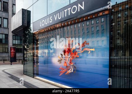 Kyiv, Ukraine. March 3, 2020. Louis Vuitton famous monogram. Multicolored logo  printed on knitted synthetic black fabric. Luxury brand backgrounds and  Stock Photo - Alamy