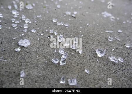 Broken glass on ground, danger and vandalism Stock Photo