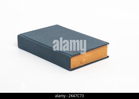 Old blue book isolated on a white background , Old vintage book with a blue cover  Stock Photo