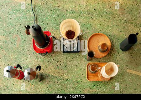 Coffee Espresso Preparing Table and Coffee Equipment on turquoise stone table in top view Stock Photo