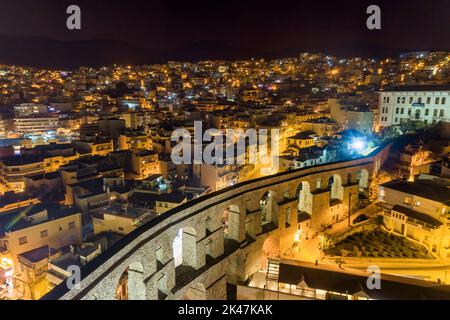 Aerial view the city of Kavala at night, in northern Greece, ancient aqueduct Kamares, homes and medieval city wall Stock Photo