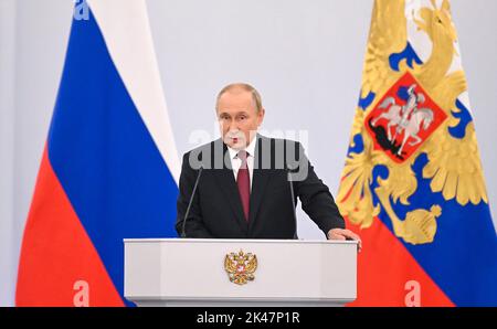 Moscow, Russia. 30th Sep, 2022. Russian President Vladimir Putin gives a speech during a ceremony formally annexing four regions of Ukraine currently occupied by Russian troops - Lugansk, Donetsk, Kherson and Zaporizhzhia, at the Kremlin in Moscow, Russia on Friday, September 30, 2022. Separatist leaders of annexed Donetsk, Lugansk, Kherson and Zaporizhzhya regions have arrived in Moscow to sign treaties to begin the process of absorbing parts of Ukraine into Russia. Photo by Kremlin Pool/UPI Credit: UPI/Alamy Live News Stock Photo