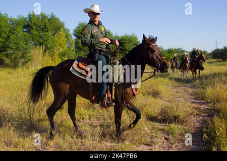 CBP, Border Patrol agents from the McAllen station horse patrol unit on patrol on horseback in South Texas.Photographer: Donna Burton Stock Photo