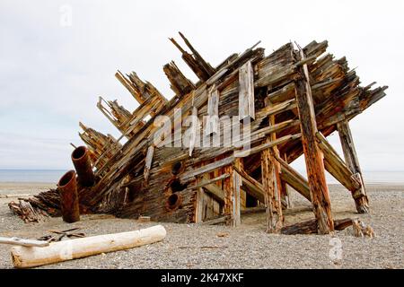 The remaining hull of the Pesuta shipwreck lying in sand north of Tlell River on East Beach in the Naikoon Provincial Park, Haida Gwaii, BC, Canada Stock Photo