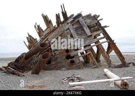 The remaining hull of the Pesuta shipwreck lying in sand north of Tlell River on East Beach in the Naikoon Provincial Park, Haida Gwaii, BC, Canada Stock Photo