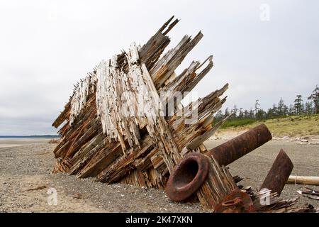 The remaining hull of the Pesuta shipwreck lying in sand north of Tlell River on East Beach in the Naikoon Provincial Park, Haida Gwaii, BC, Canada Stock Photo