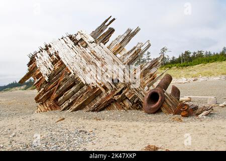 The remaining hull of the Pesuta shipwreck lying in sand north of Tlell River on East Beach in the Naikoon Provincial Park, Haida Gwaii, BC, Canada Stock Photo