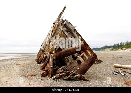 The remaining hull of the Pesuta shipwreck lying in sand north of Tlell River on East Beach in the Naikoon Provincial Park, Haida Gwaii, BC, Canada Stock Photo