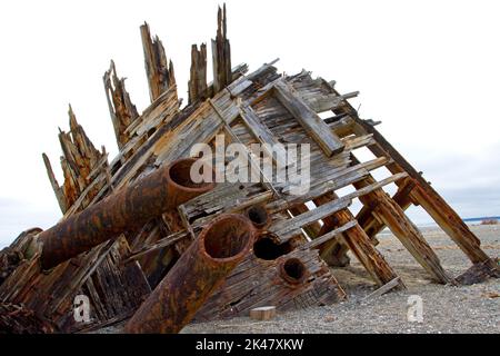 The remaining hull of the Pesuta shipwreck lying in sand north of Tlell River on East Beach in the Naikoon Provincial Park, Haida Gwaii, BC, Canada Stock Photo