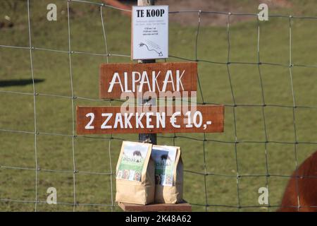 Alpaca droppings in bags for manure for sale at farm in Nieuwerkerk aan den IJssel Stock Photo