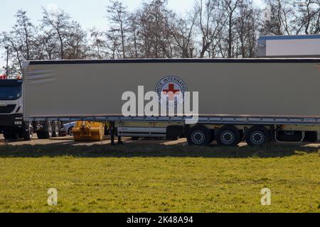 Trucks destinated for Africa to support the Red Cross organization ready for transport Stock Photo