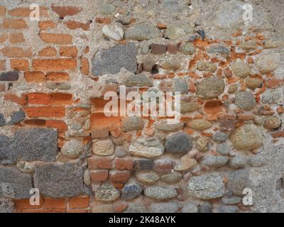 red bricks and stones wall useful as a background Stock Photo