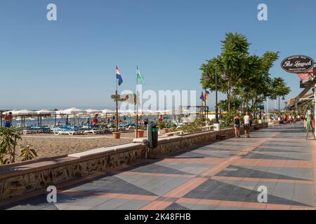 View of the popular Mediterranean resort of La Carihuela with its summer beach life. Stock Photo