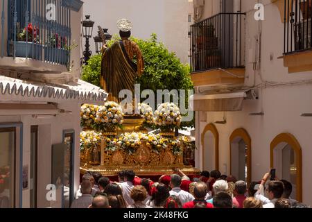 Statue of Saint Bernard on the float being carried into the church in the Romeria San Bernabe in Marbella, Spain. Stock Photo