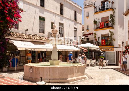 Cozy little square (plaza fernando alcala) with a fountain in the old town of Marbella in Spain. Stock Photo