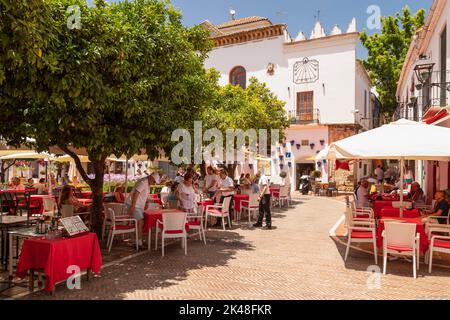 Cozy little square with shops and restaurants on the Plaza de los Naranjos square in the old center of Marbella in Spain. Stock Photo