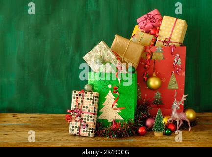 gift bags with christmas gifts, decoration, christmas baubles and christmas tree,free copy space Stock Photo